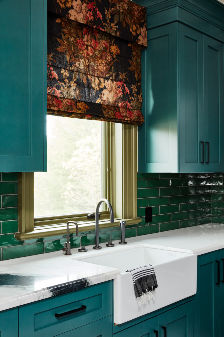 green-blue-kitchen-cabinets-dark-floral-window-treatment